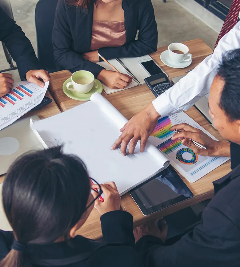 HR consultants reviewing reports with a client team